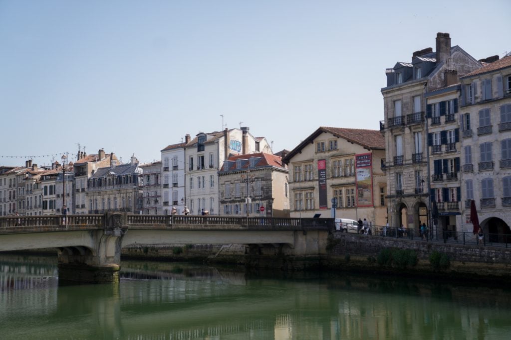 Riverside buildings and a bridge in Bayonne