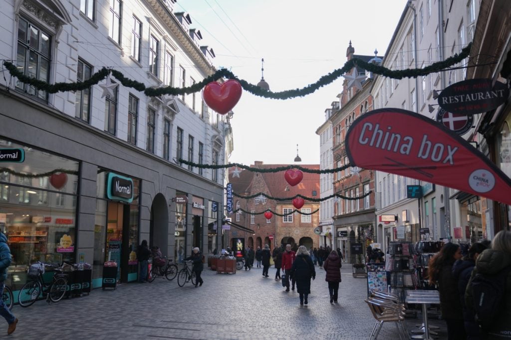 Christmas garlands above a busy street in Copenhagen’s Indre By
