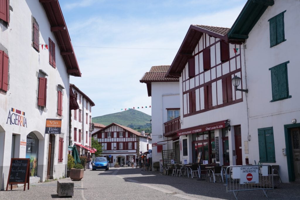 White-and-red timbered buildings along a street in Espelette