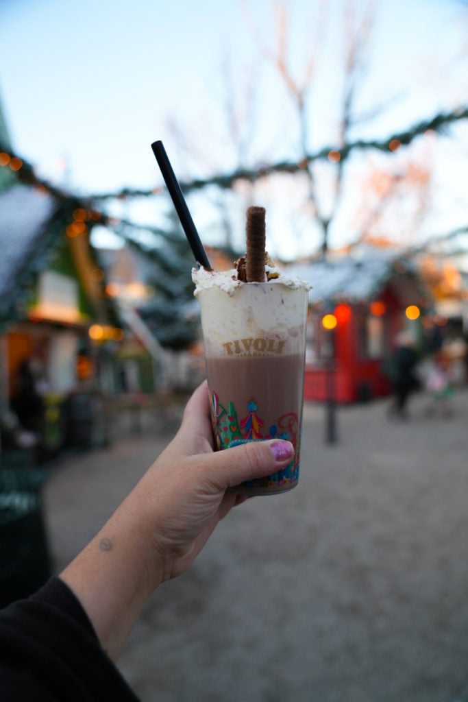 Hand holding hot chocolate at Tivoli