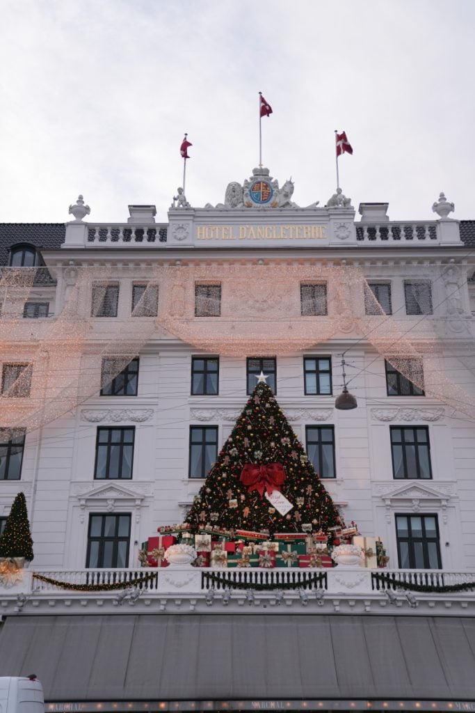 Hotel d’Angleterre facade decorated with a Christmas tree and gifts