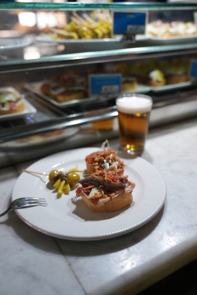 Plate of pintxos and beer at a Bilbao bar