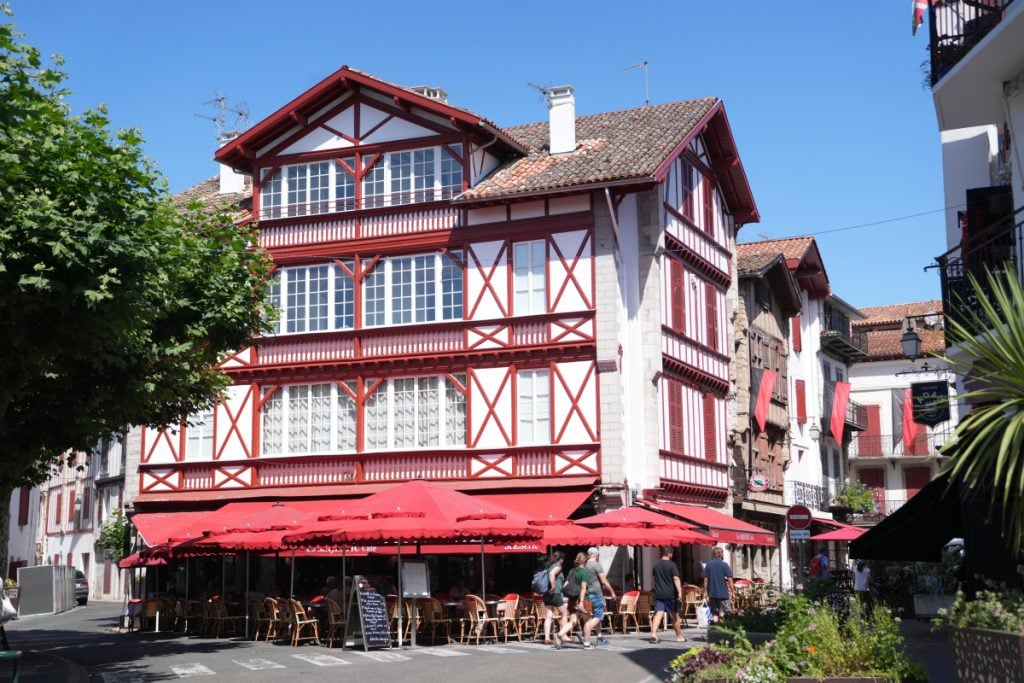 Red-and-white timbered building and café in Saint-Jean-de-Luz
