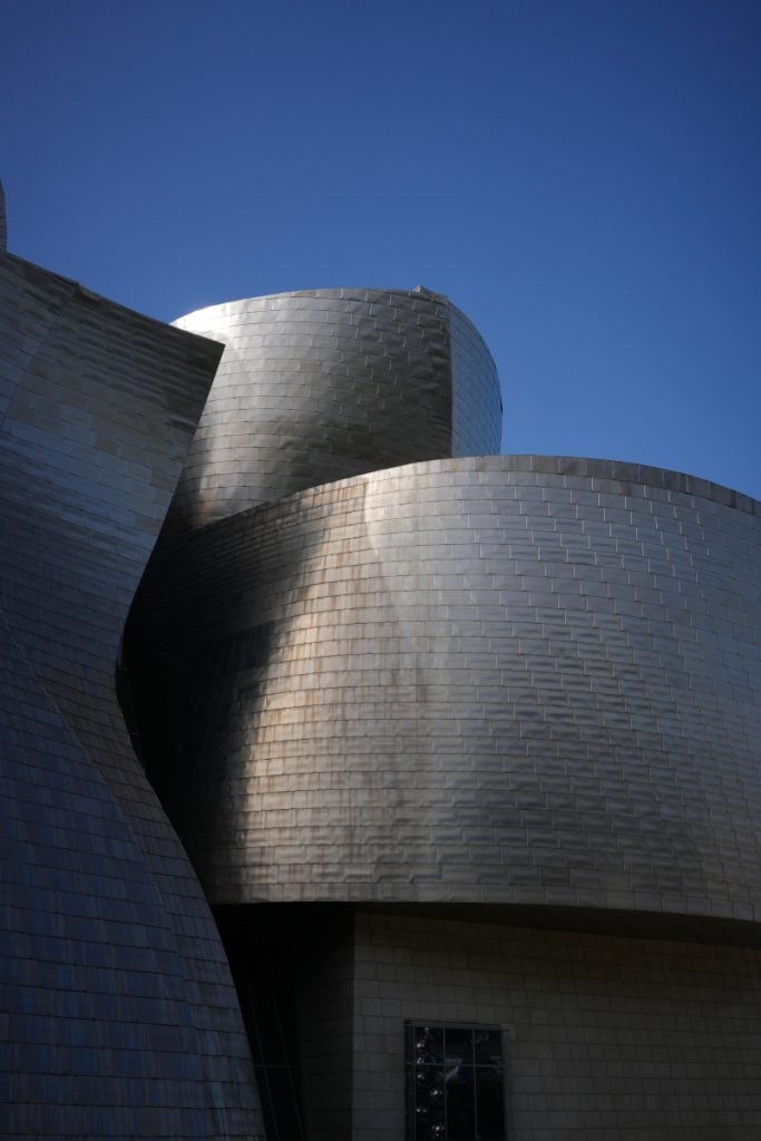 Curved metal facade of the Guggenheim Museum Bilbao