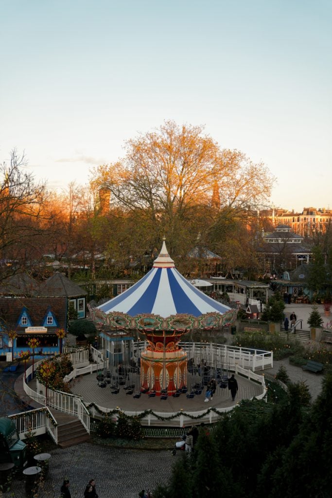 Christmas-trimmed swing carousel at Tivoli Gardens