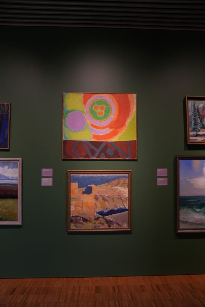 Gallery wall at ARoS with abstract and landscape paintings