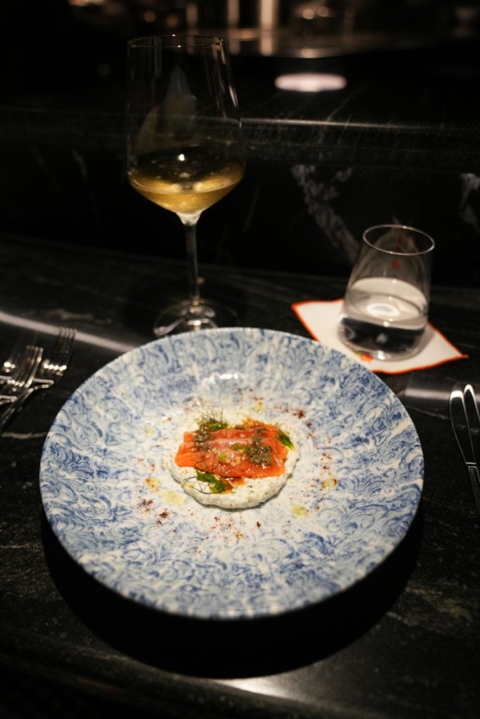 Small plated course with orange topping at Amapola