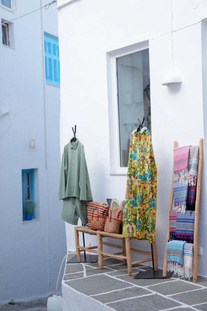 Clothing and woven goods displayed outside an Apollonia shop