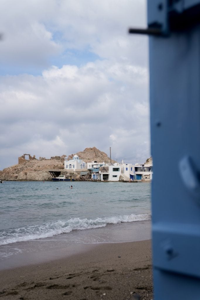 Waterfront boathouses across the cove in Firopotamos