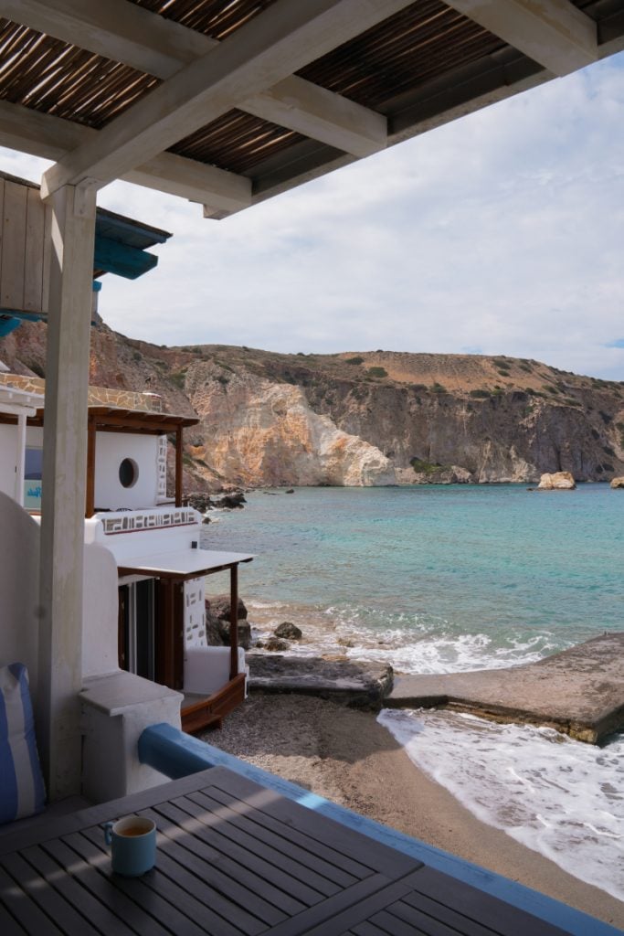 Firopotamos boathouse patio overlooking a turquoise cove
