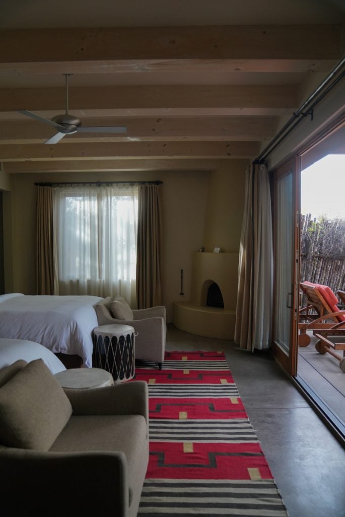 Four Seasons Rancho Encantado room with kiva fireplace and patio