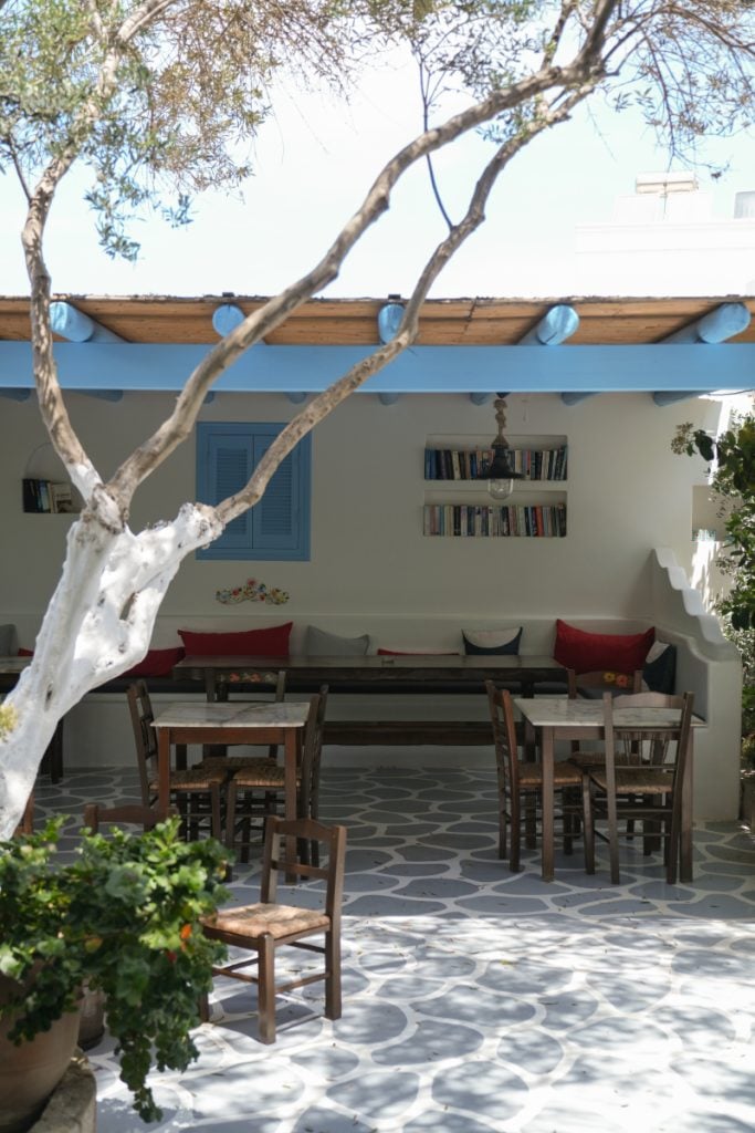 Tree-shaded patio at Kivotos ton Gefseon
