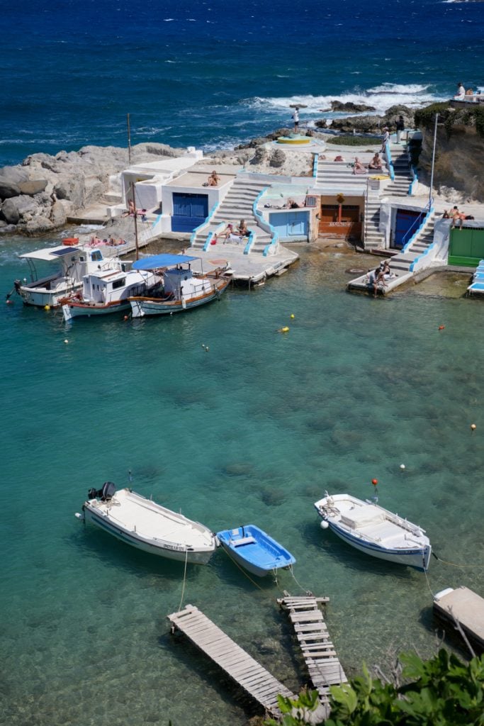 Boats and waterfront boathouses in Mandrakia harbor