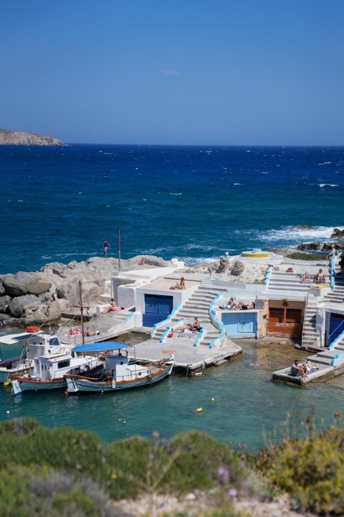Fishing boats and waterfront boathouses in Mandrakia
