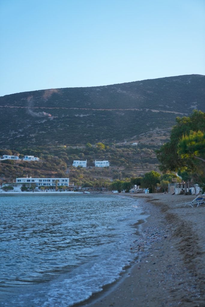 Platis Gialos shoreline beneath green hills in Sifnos