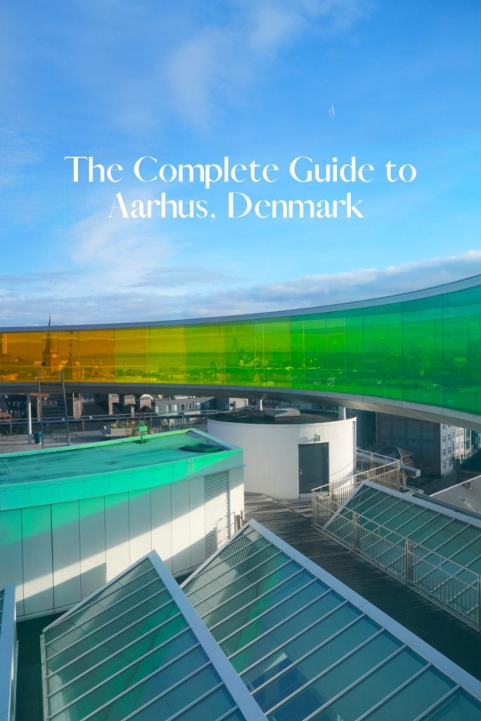 Aarhus travel guide graphic with a rainbow-colored rooftop walkway