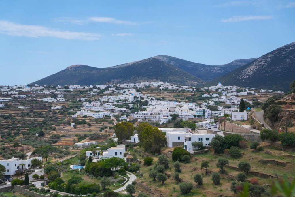 Whitewashed village spread across terraced hills in Sifnos