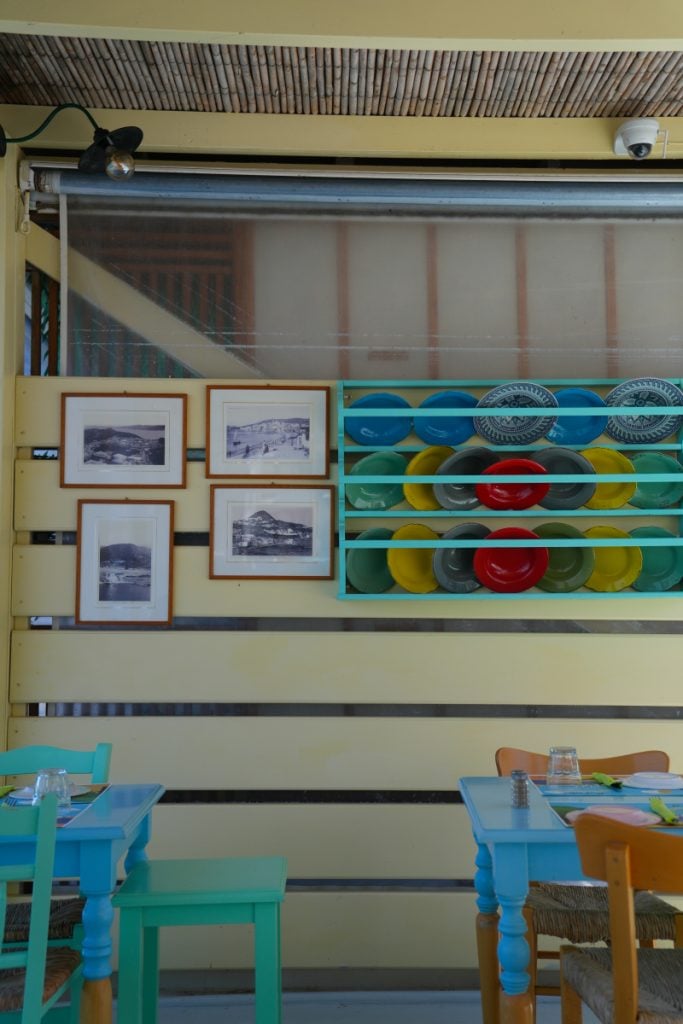 Colorful plates displayed inside Akrotiri Restaurant