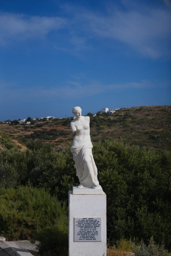 Venus de Milo replica on a hillside in Milos