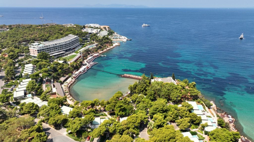 Astir Bay’s turquoise shoreline and beachfront resort