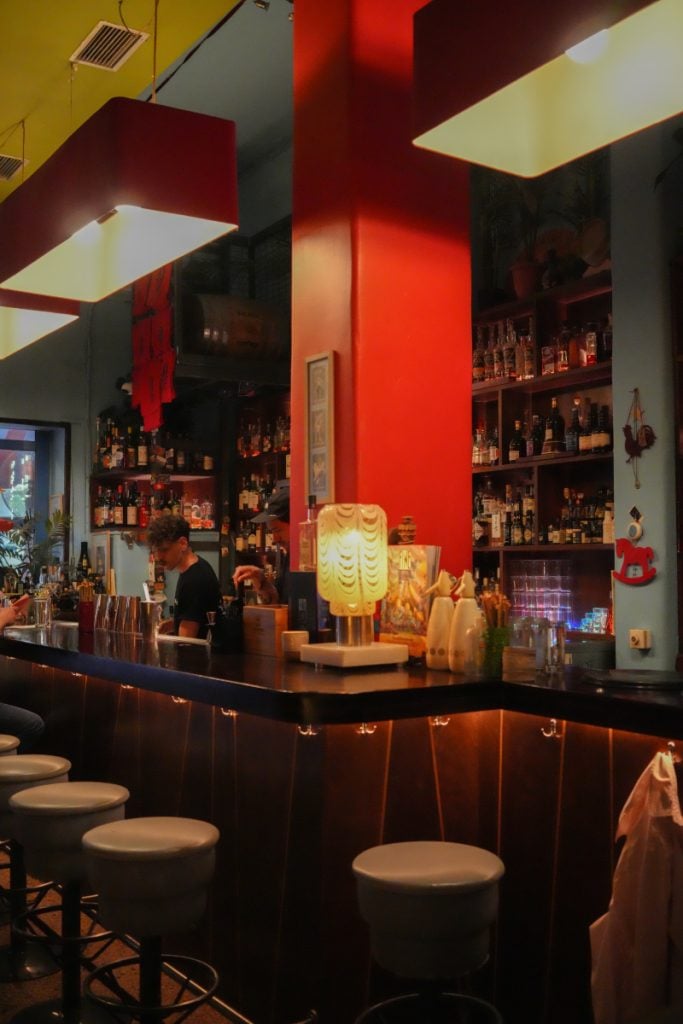 Red-walled bar interior at Baba au Rum