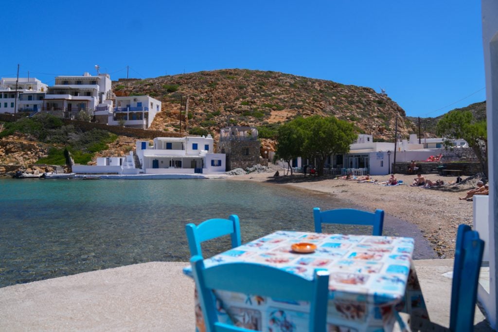Blue chairs overlooking the beach at Cheronissos Fish Taverna