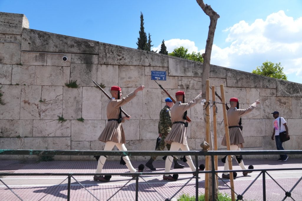 Evzones march during the changing of the guard at Syntagma
