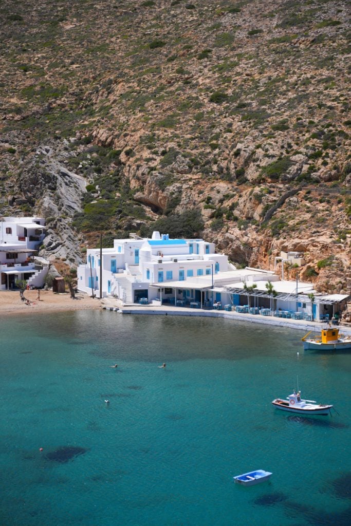 White waterfront buildings and boats at Cheronissos Beach