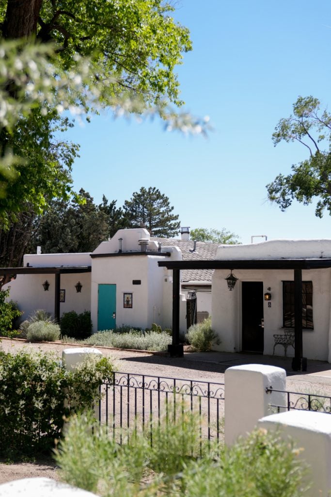 White adobe guest rooms at El Rey Court
