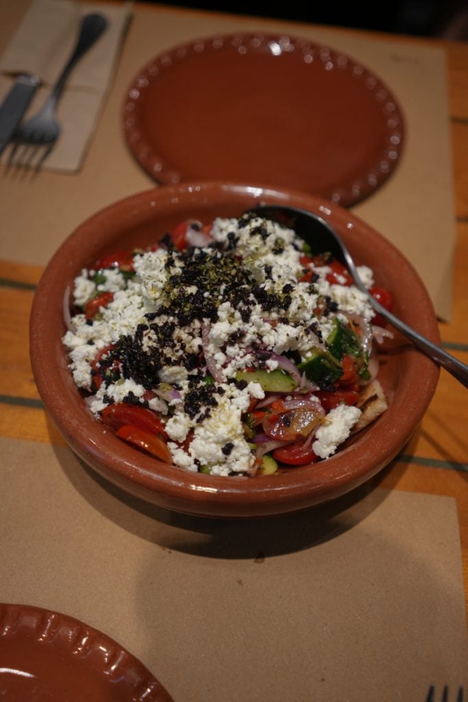 Greek salad topped with feta and olives at ERGON House