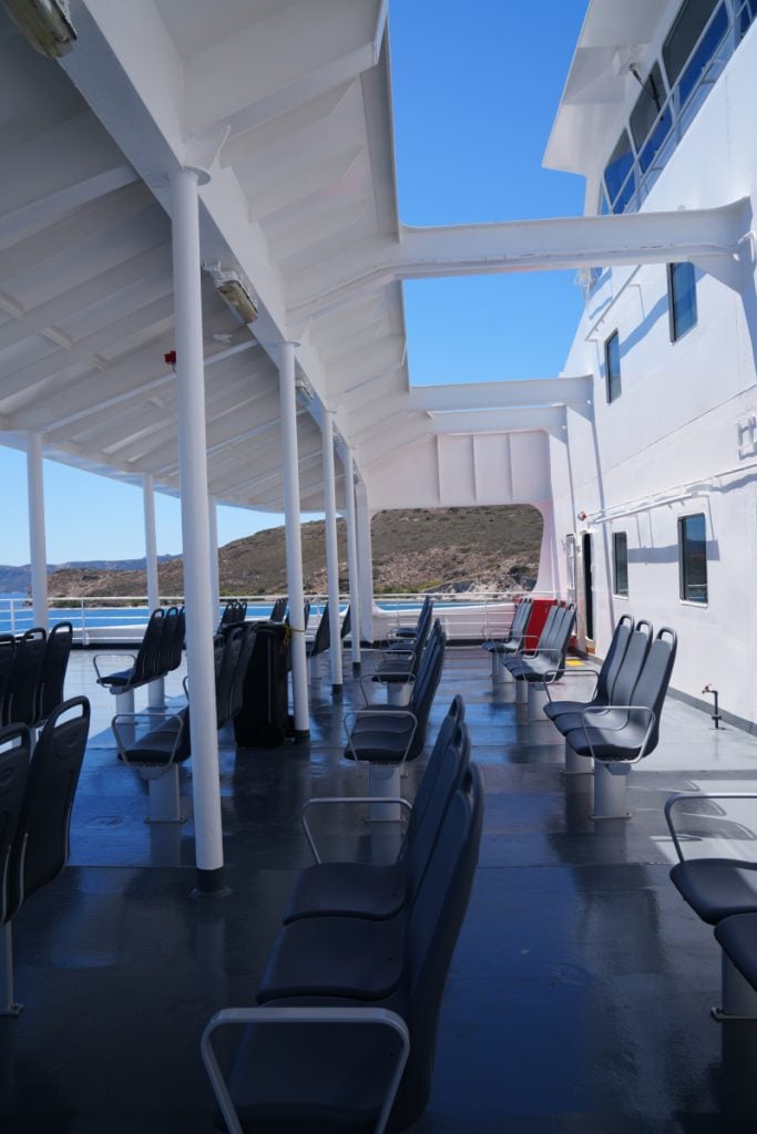 Rows of empty seats on a ferry deck