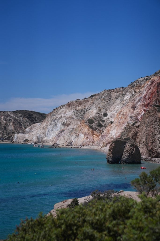 Colorful volcanic cliffs above Firiplaka Beach