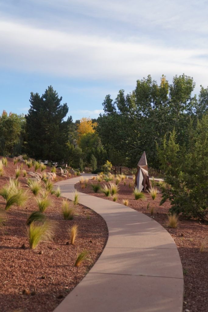 Winding garden path and sculpture at Four Seasons Rancho Encantado