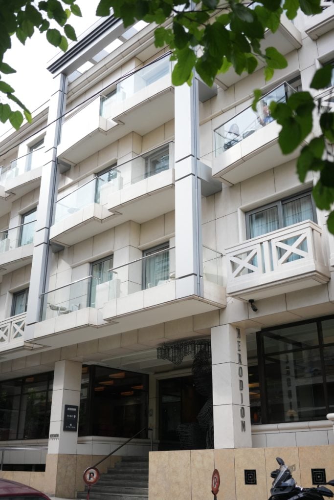 Herodion Hotel exterior with glass balconies