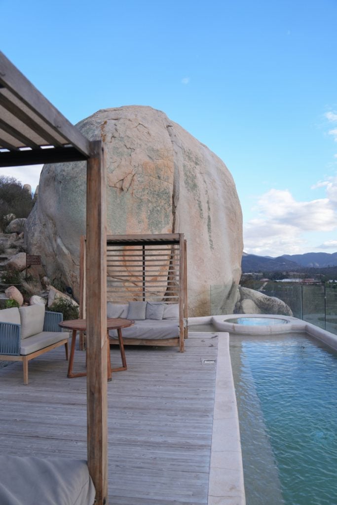 Banyan Tree Veya pool terrace beside a giant boulder