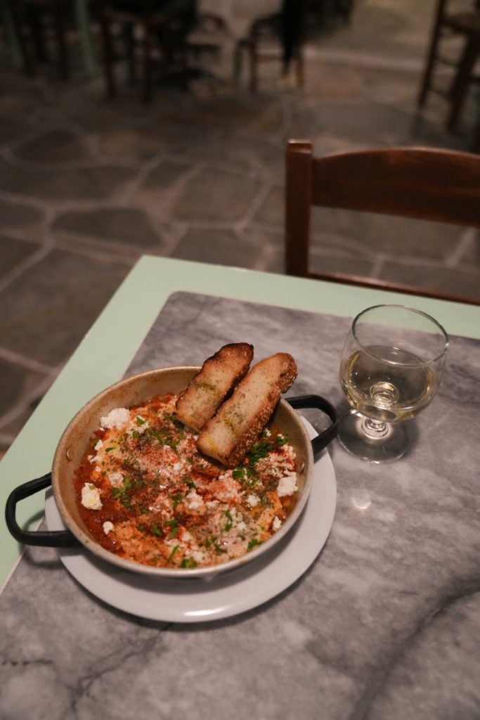 Tomato dish topped with cheese and herbs at Kafeneio Drakakis