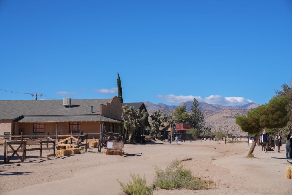Western-style storefronts along a sandy street in Pioneertown