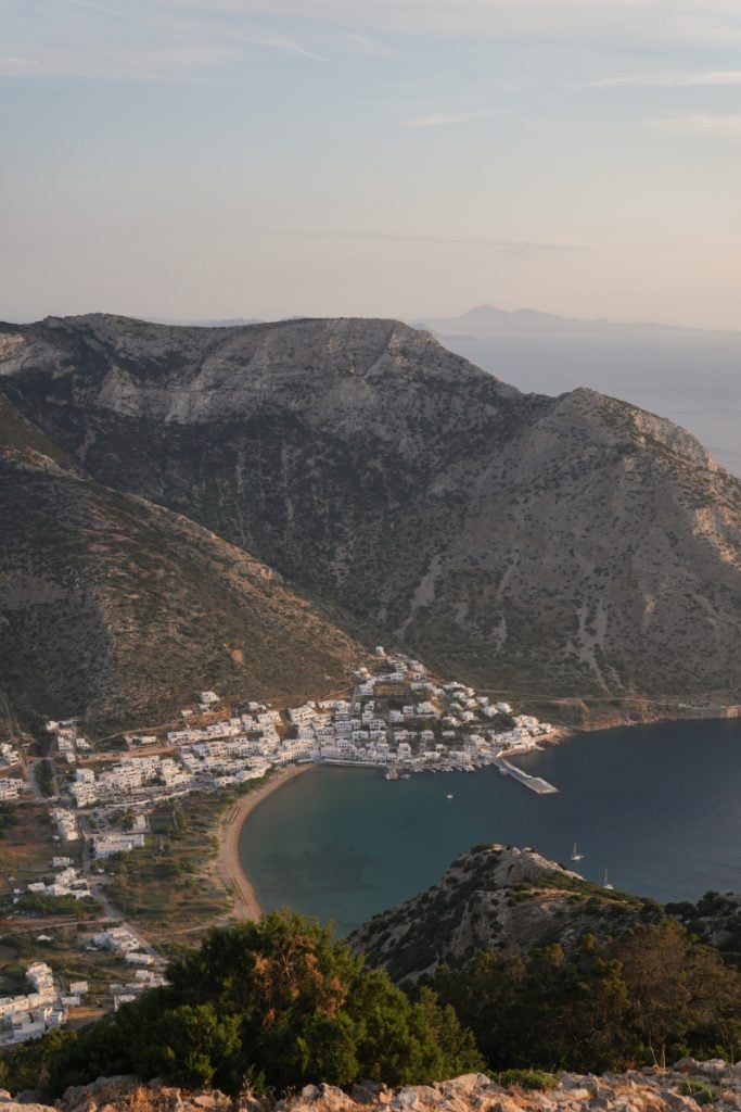 View down to Kamares port and its curved bay between steep hills.