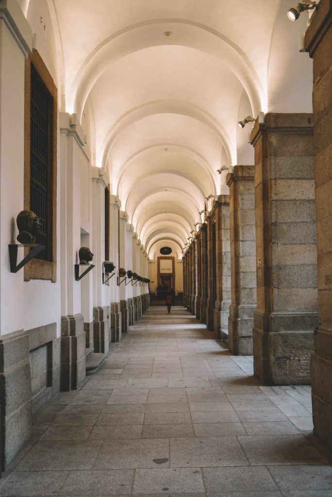 Vaulted corridor with busts inside the Prado Museum