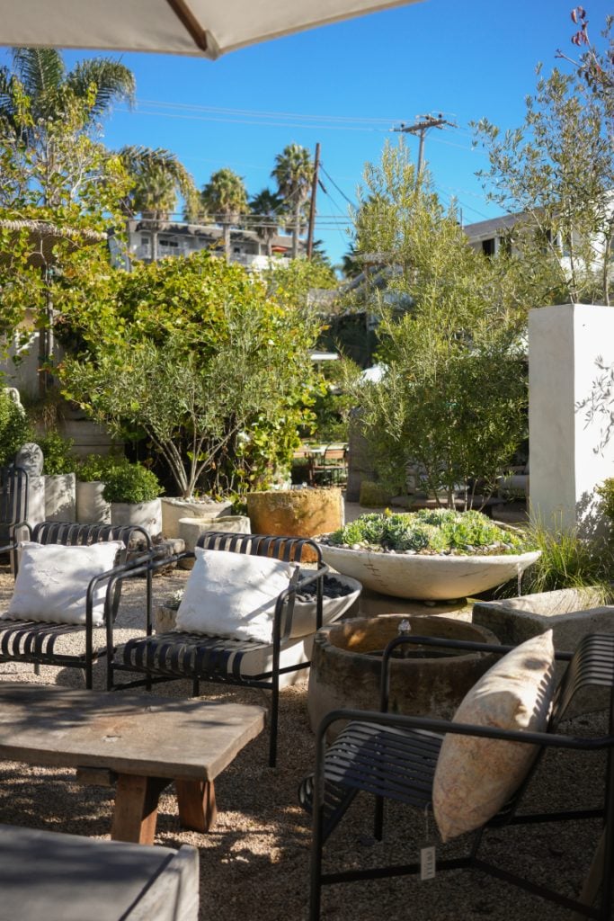 Outdoor furniture and large garden planters at The Well in Summerland