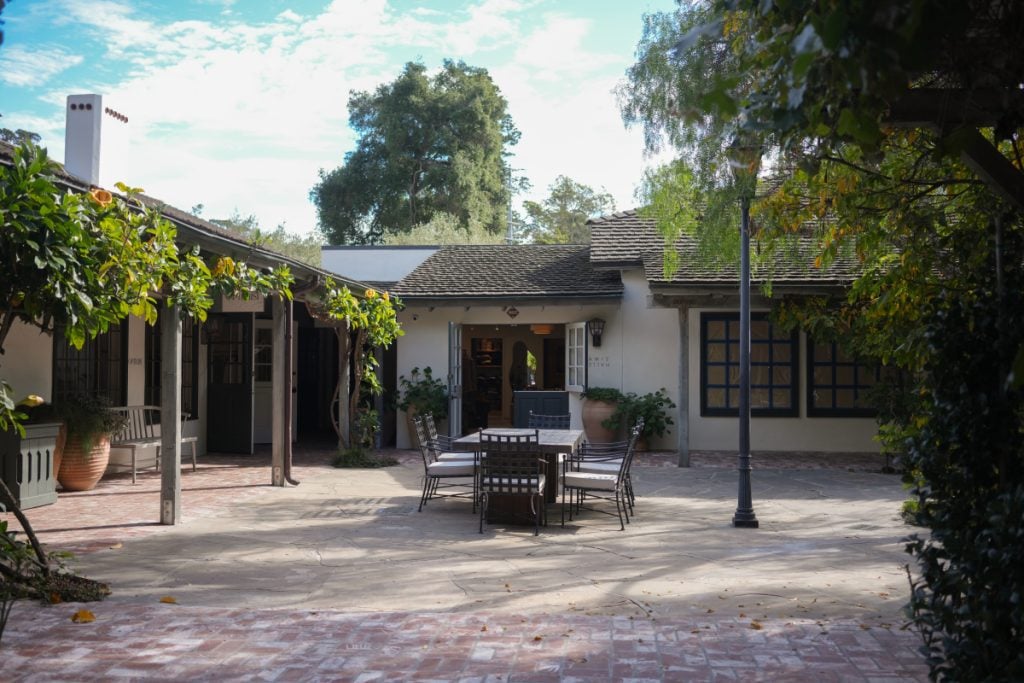 Shops surrounding a courtyard with outdoor seating at The Post Montecito